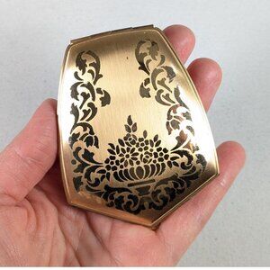 Vintage Elgin American Beauty gold tone floral powder compact in good condition,